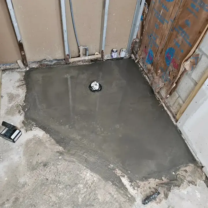 Shower floor mortar bed sloped toward the drain