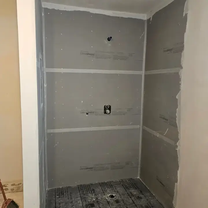 Cement board on the shower walls with a niche framed in