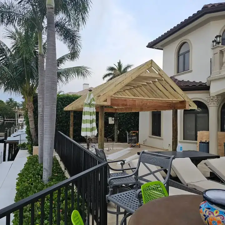 Pavilion roof trusses framed over the patio