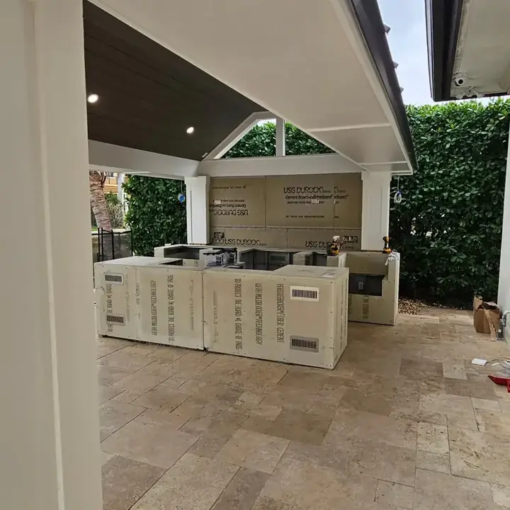 Outdoor kitchen base being built under the new pavilion