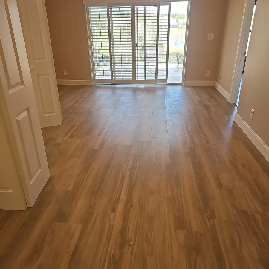 New wood-look plank flooring through the rooms of a home